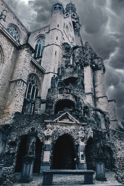 Ancient cathedral with dark clouds behind