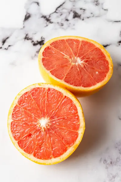 Overhead View Cut Red Grapefruit White Marble Table Vertical Copy — Stock Photo, Image