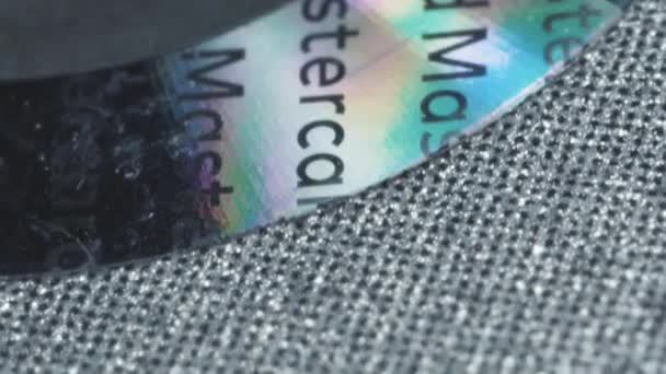 Macro Slide Shot Halogram Plastic Card Inscription Master Card — Vídeos de Stock