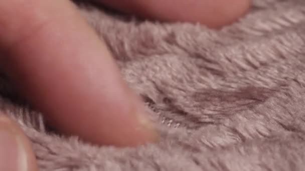 Man Hand Touches Pale Pink Blanket Close — Vídeo de stock