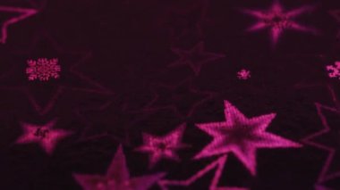 Makro kaydırak atışı, pembe yıldızlar ve kar taneleri parıldıyor ve yanıp sönüyor.