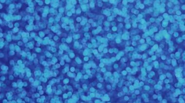 Mavi bokeh. Parlak topların etkisi ve bulanıklığı. Odaklanamayan tatil ışıkları. Parıltı