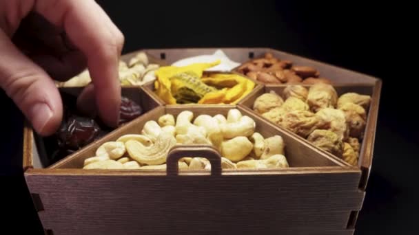 Eat Dried Fruits Nuts Wooden Box Close Motion — Vídeos de Stock