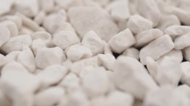 White granules, fertilizer for plants. Macro slide shot