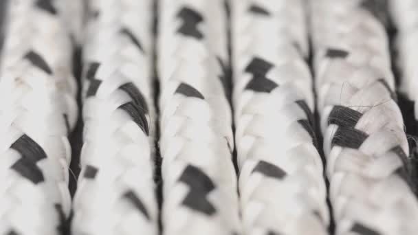 Thick Braided White Rope Black Spots Macro Slide Shot — Vídeo de Stock