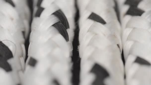 Thick Braided White Rope Black Spots Macro Slide Shot — Vídeos de Stock