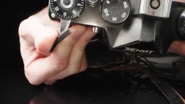 Russia, Moscow 10.04.2022. Old ZENIT 10 camera, checking work, close-up.