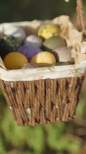 Girl Holds Knitted Basket Decorated Easter Eggs Forest Background Green — Vídeo de Stock