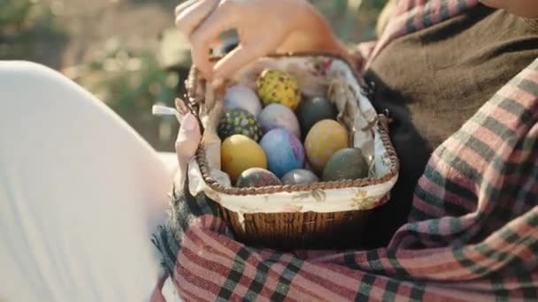 Close Girl Who Sitting Holding Basket Easter Decorated Eggs Sunny — Wideo stockowe