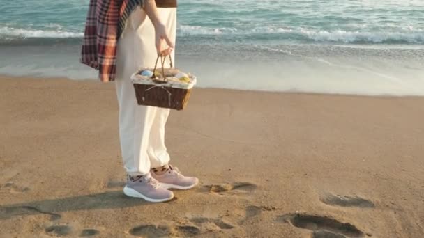 Girl Stands Sand Next Sea Waves Holds Basket Eggs Easter — Video