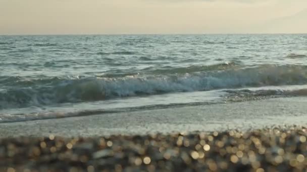 Sunset Rocky Beach Sea Yellow Speckled Easter Egg Your Feet — стокове відео