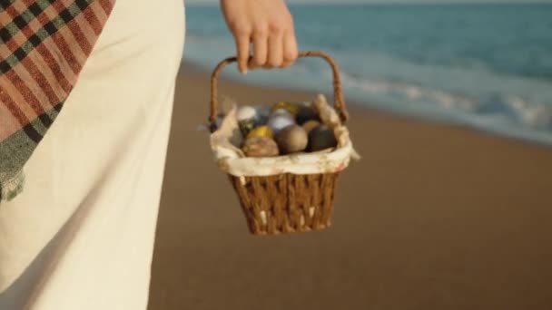 Girl Walks Basket Easter Eggs Sea Beach Sunset Rear View — Stock video