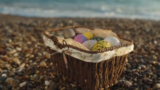 Wicker Basket Easter Eggs Rocks Sea Sunset Slow Motion — Vídeos de Stock