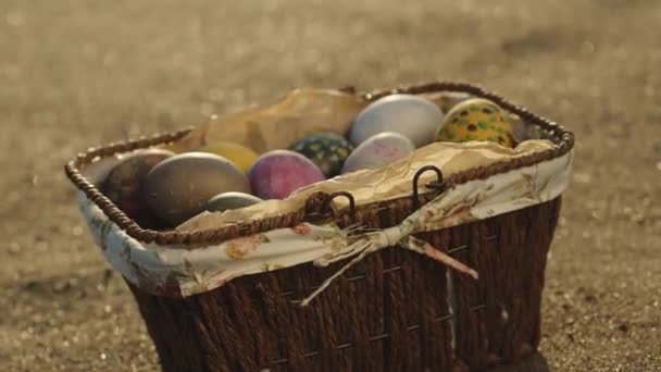 Wicker Basket Easter Eggs Sand Sea Tilt Slow Motion Close — Stockvideo
