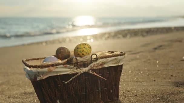 Wicker Basket Painted Easter Eggs Sunset Sea — Vídeos de Stock