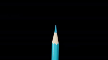Blue pencil on a black background, magnification. Dolly slider extreme close-up. Laowa Probe
