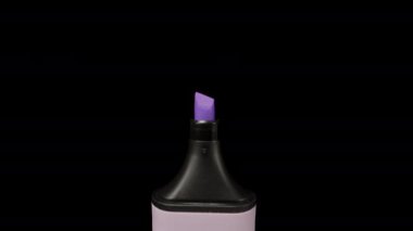 Violet marker on a black background, magnification. Dolly slider extreme close-up. Laowa Probe