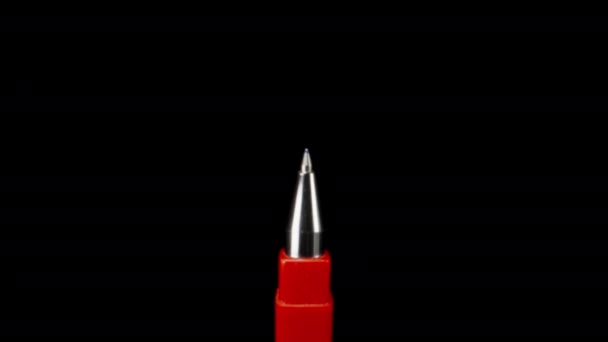 Red Ballpoint Pen Black Background Magnification Dolly Slider Extreme Close — Vídeos de Stock