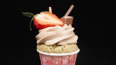 Cupcake with strawberries, chocolate and cookie sticks. Dolly slider extreme close-up. Laowa Probe