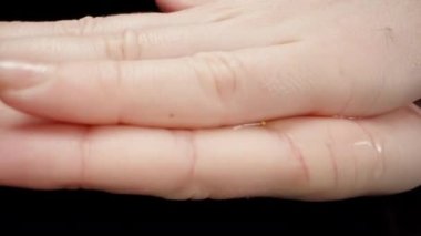 I rub the antiseptic gel on my hands. Dolly slider extreme close-up. Laowa Probe