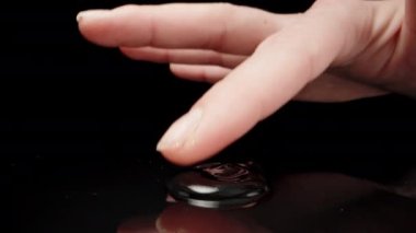 Antiseptic gel on the table. I touch with my finger. Dolly slider extreme close-up. Laowa Probe