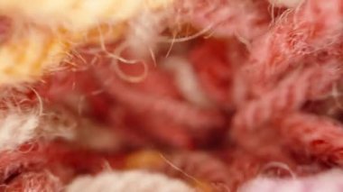 multi-colored woolen threads, fabric. Dolly slider extreme close-up inside. Laowa Probe