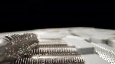 A set of taps for cutting threads in metal in a box. Dolly slider extreme close-up. Laowa Probe