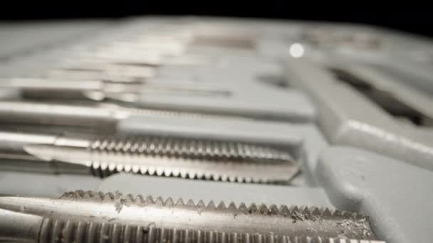 Set Taps Cutting Threads Metal Box Dolly Slider Extreme Close — стоковое видео