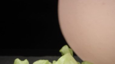 I'm making a sandwich. I put a piece of sausage on bread. Dolly slider extreme close-up inside. Laowa Probe