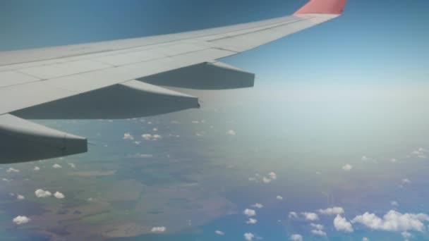 Airplane Wing Clouds Flying Sea Land — Stockvideo