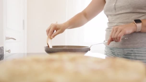 Young Woman Removes Pancake Pan Wooden Spatula Close — Stockvideo