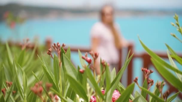 Young Woman Stands Background Sea Flowers All Slow — Wideo stockowe