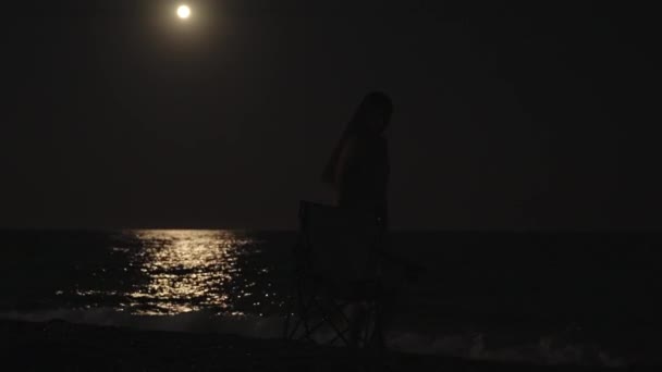 Young Woman Sits Chair Sea Looks Moon She Picks Chair — Stock Video