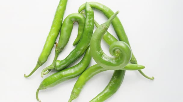 Green Twisted Hot Pepper Rotates White Background Other Peppers Top — Stock Video