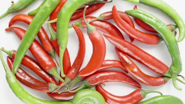 Red Hot Pepper Rotates Background Green Red Peppers Table Top — Stock Video