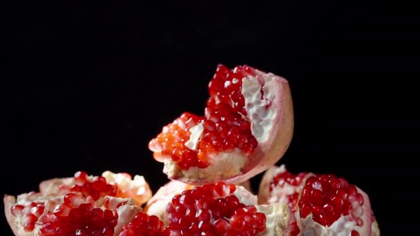 Pomegranate Fruit Divided Parts Rotates Background Pieces Red Grains Black — Stock Video