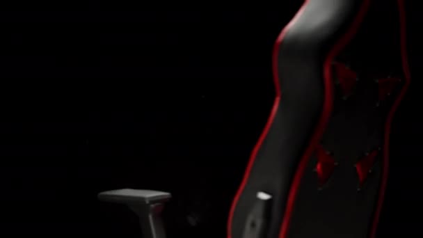 Black Red Gaming Computer Chair Rotates Black Background — Stock Video