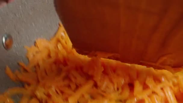 Stir Wooden Spatula Carrots Fried Frying Pan Macro Shot Pov — стоковое видео