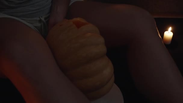 Young Woman Candlelight Red Light Admires Carved Pumpkin Halloween — Stock Video