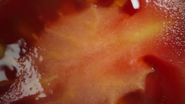 Sliced Cherry Tomato Rotates Black Background Dolly Slider Extreme Close — Stock Video