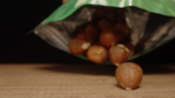 Pour Hazelnuts Wooden Table Camera Close Slider Slow Motion — Stock Video