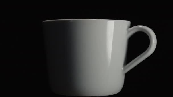 White Mug Rotates Dark Close Heart Shaped Shadow Mug — Stock Video
