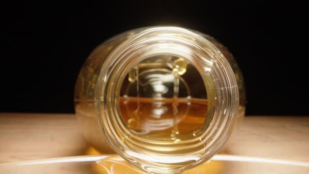 Camera Drives Jar Honey Pours Dolly Slider Extreme Close — Stock Video