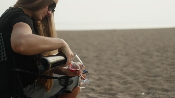 Young Woman Sits Chair Sea Pours Wine Glass Drinks — Stock Video