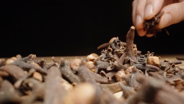 Put Handful Dried Cloves Scattered Table Black Background Close — Stock Video