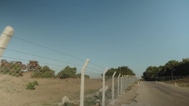 Sunny Weather Walking Road Which Fences Barbed Wire — Stock Video