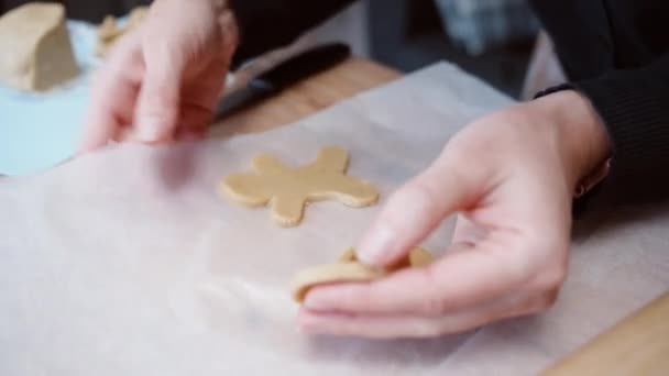 Woman Transfers Candy Cane Shaped Gingerbread Dough Baking Sheet Lined — Stock Video