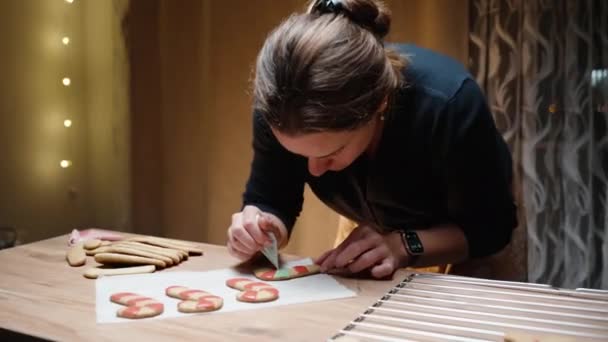 Warm Christmas Home Interior Young Woman Decorating Gingerbread Cookies Shape — Stock Video