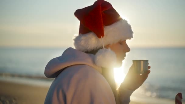 Young Woman Santa Hat Celebrates Christmas Sea Hot Tea Gingerbread — Stock Video