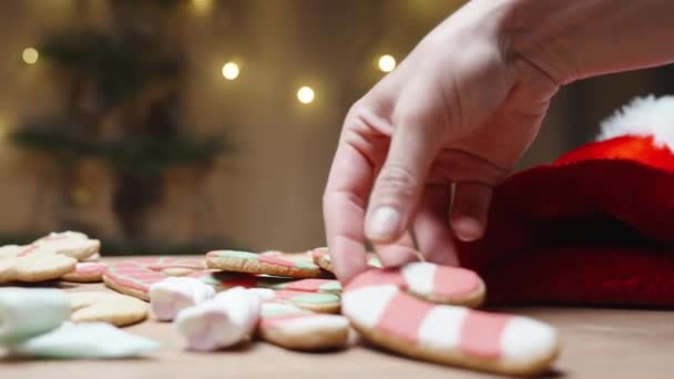 Woman Takes Gingerbread Cookie Shape Candy Cane Inserts Glass Hot — Stock Video
